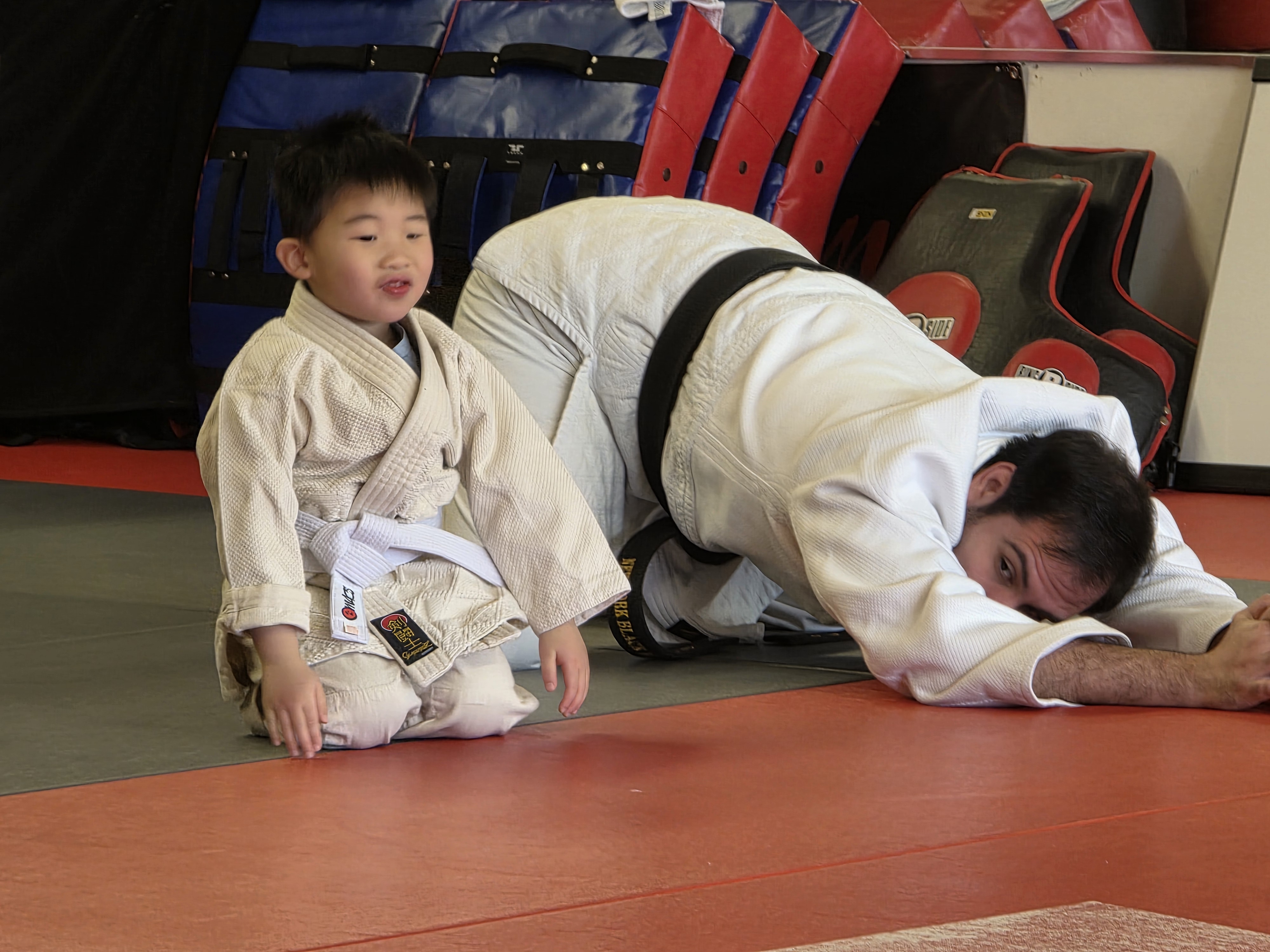 A young NYBBC Judo student training with an instructor